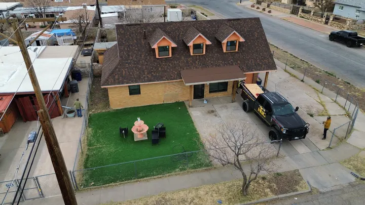 New architectural shingle roof with dormers and the HGC truck on site