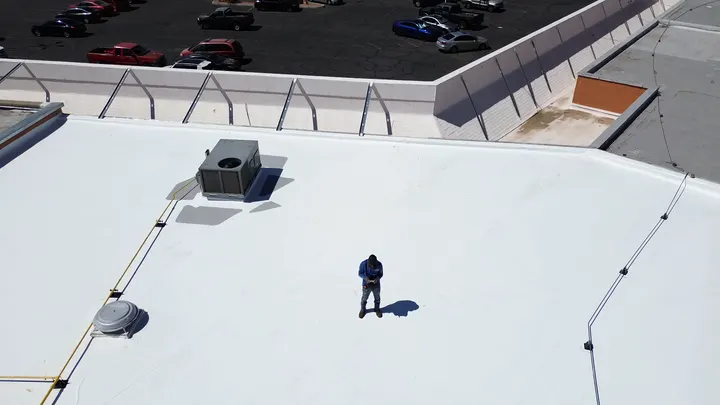 HGC technician running a drone roof inspection