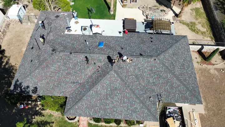 Shingle roof replacement in progress